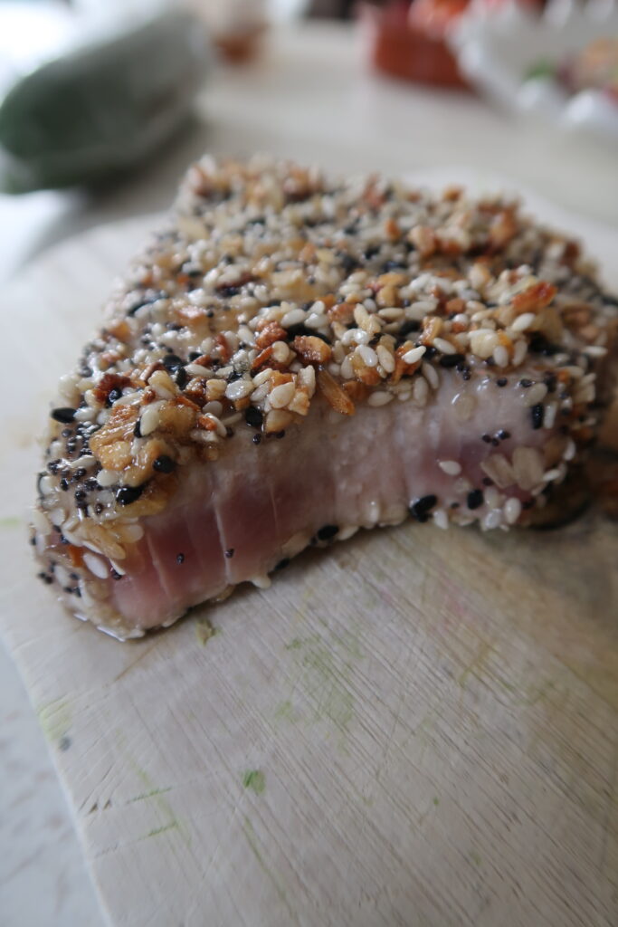 Asian sesame-crusted tuna with garlic ginger dressing and summer vegetable salad