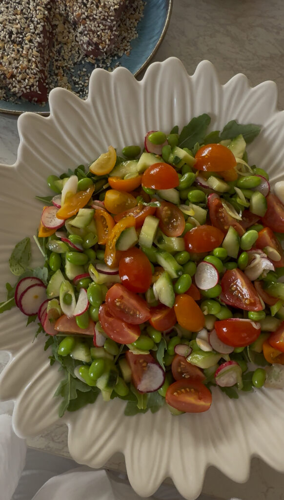 Asian sesame-crusted tuna with garlic ginger dressing and summer vegetable salad