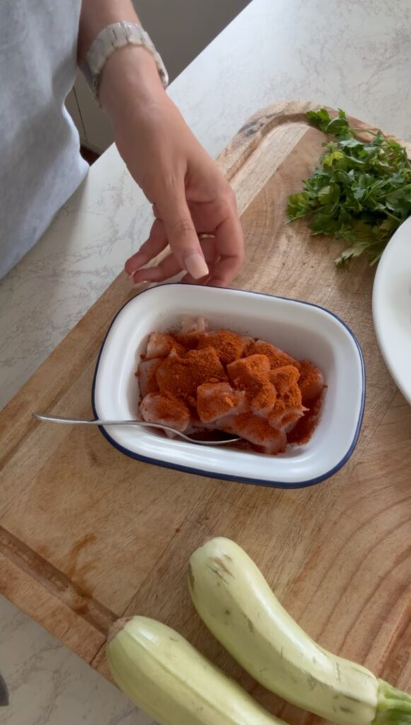 Ingredients for creamy chicken tofu tikka masala including chicken breast, tofu, tikka paste, coconut cream and spices