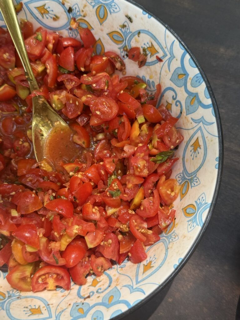 Simple tomato salad, an example of how travel influences cooking by teaching restraint and the beauty of three perfect ingredients.