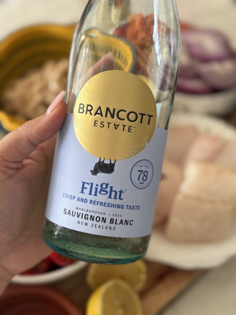 Close-up of baked cod with chorizo base ingredients brancott estate flight sauvignon blanc