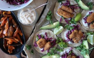crispy cod tacos overhead shot with sweet potatoes chilli cream and slaw