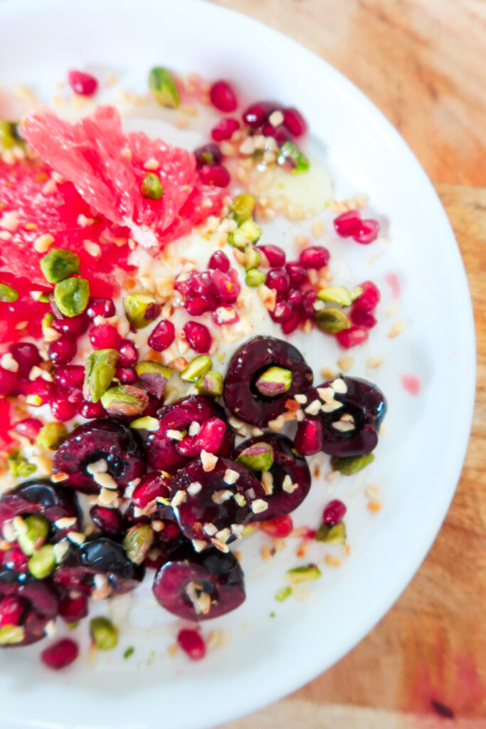 a perfectly assembled breakfast bowl overhead shot showcasing all the seasonal  ingredients
