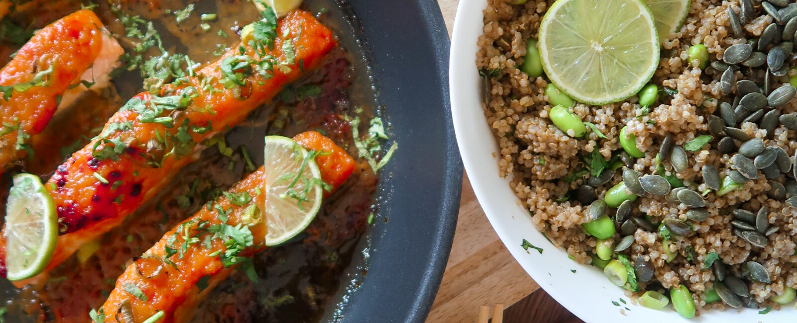Glazed salmon fillet atop garlic-ginger quinoa pilaf with miso-glazed corn and fresh herbs.