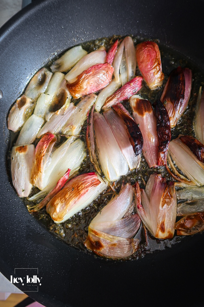 Pan of shallot and tomato tart just flipped and cooling