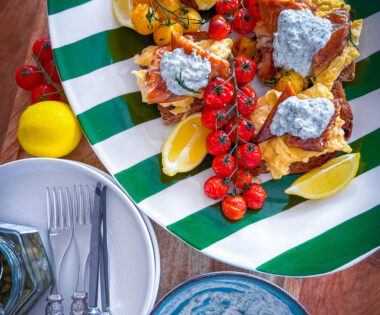 Scandi-style breakfast with eggs, mackerel, tomatoes, and crème fraîche on sourdough.