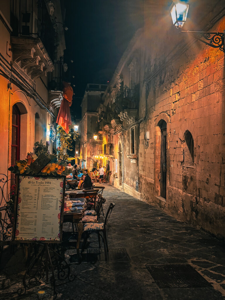 Bustling market street outside la fogliq — where to eat in Ortigia’s liveliest strip