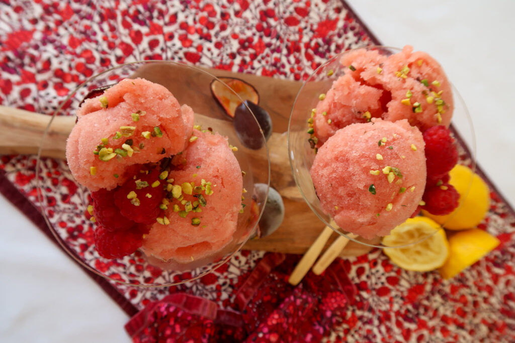 Close-up of no-churn nectarine and passion fruit sorbet, served with passion fruit pulp