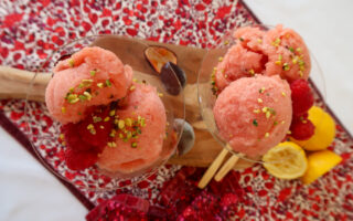 Close-up of no-churn nectarine and passion fruit sorbet, served with passion fruit pulp