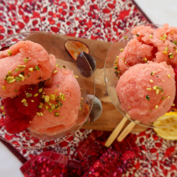 Close-up of no-churn nectarine and passion fruit sorbet, served with passion fruit pulp