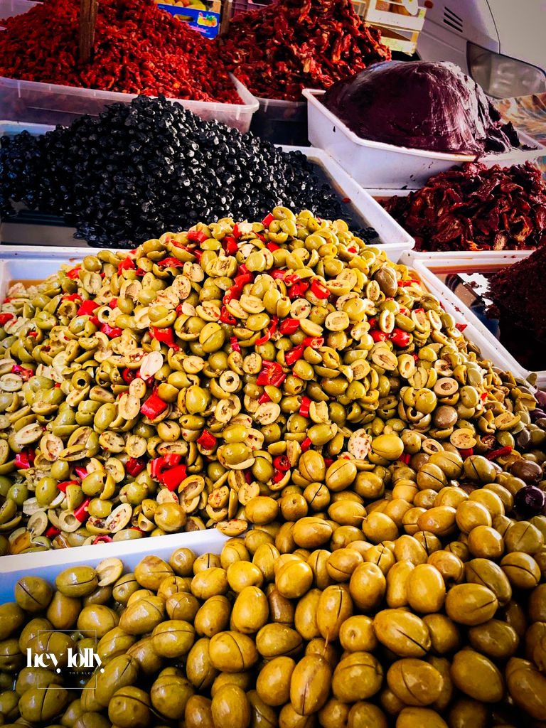 Fresh produce stalls at Ortigia’s daily open market with citrus and vegetables