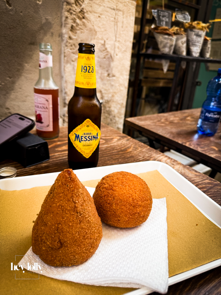 Narrow cobbled street in Ortigia serving arancini