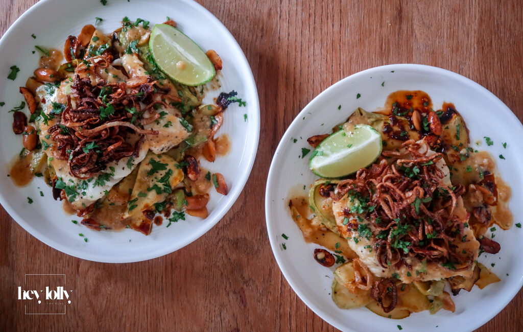 Plated miso butter cod with sesame courgette noodles and crispy shallots
