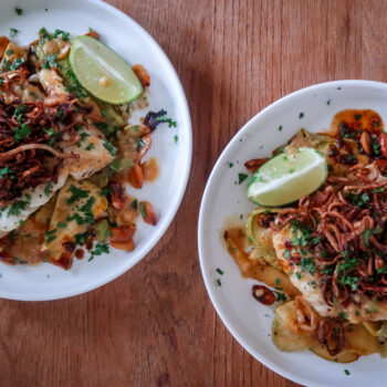 Plated miso butter cod with sesame courgette noodles and crispy shallots