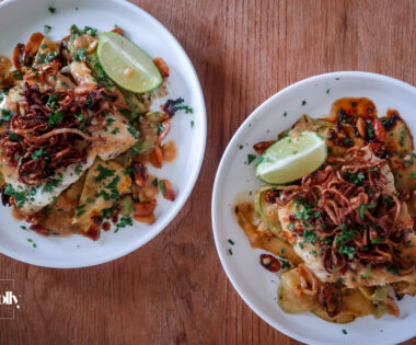 Plated miso butter cod with sesame courgette noodles and crispy shallots