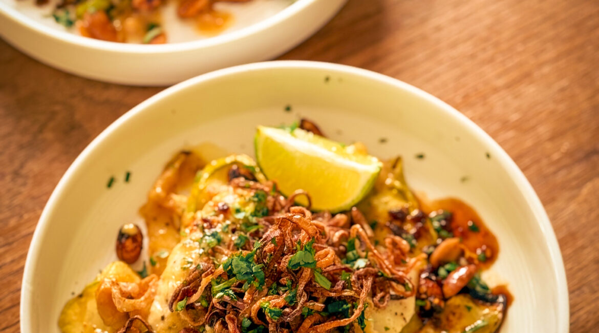 Raw cod fillets with miso butter ingredients on a board