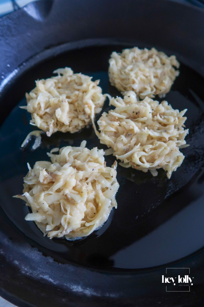 Golden potato cakes sizzling in a pan of hot oil.