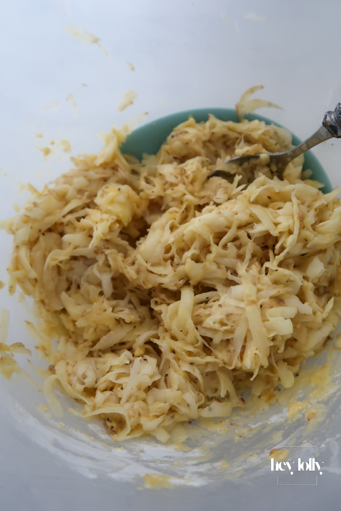 Grated potato and onion squeezed in a cloth, ready to make crispy potato cakes.
