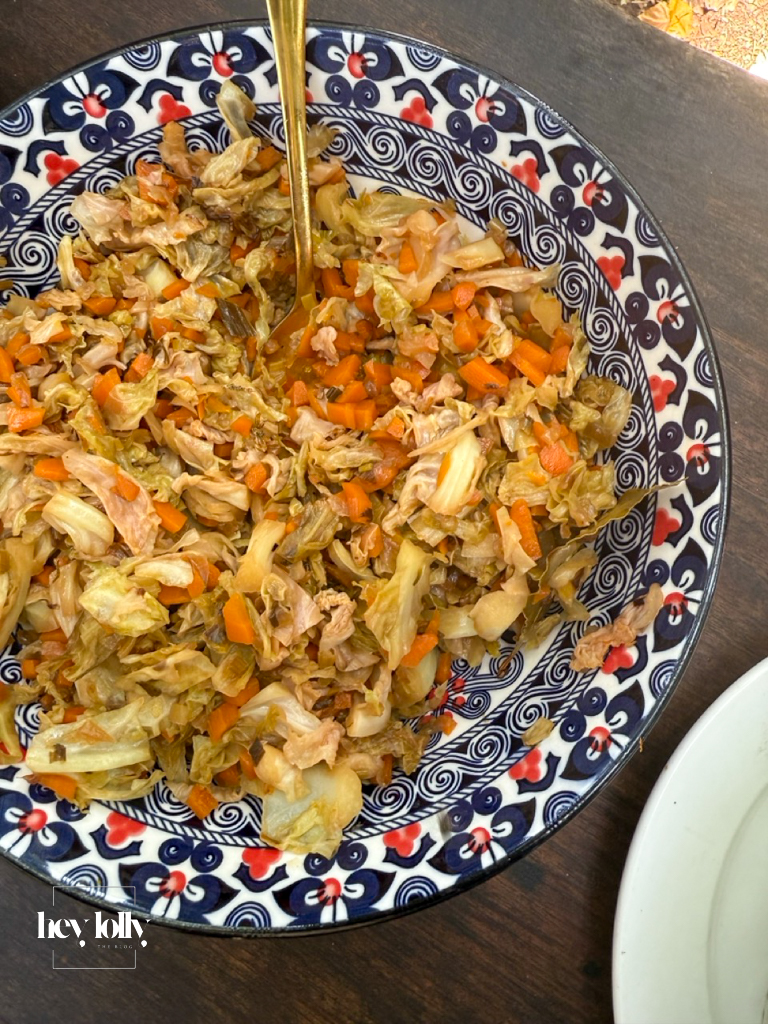 Cooked cabbage and carrots served in a decorative bowl during the outdoor cooking class in Siracusa.