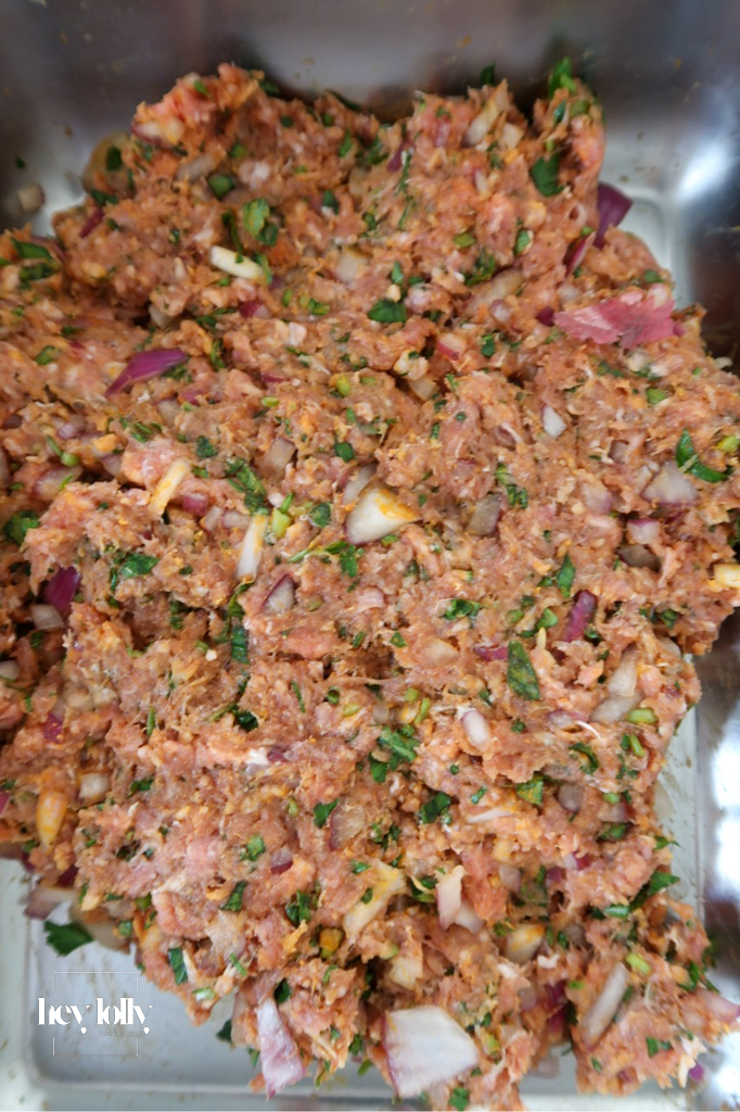 Raw lamb mince with harissa paste, onion, garlic, cumin, parsley, and egg — base ingredients for Harissa Lamb Meatballs with Pomegranate Molasses