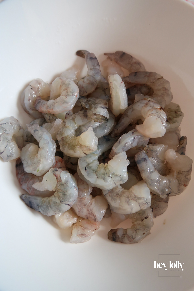 Fresh ingredients for king prawn tomato risotto including prawns shrimp