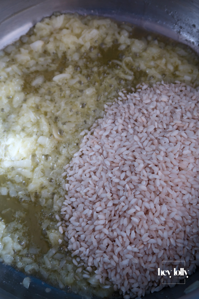 Arborio rice stirred into onions and garlic before adding stock