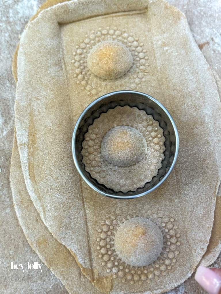 Close-up of ravioli being sealed and prepared in the outdoor kitchen in Sicily.