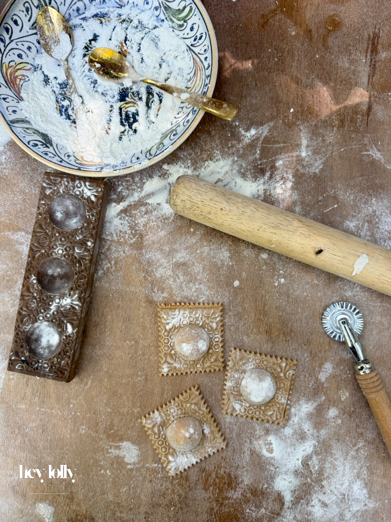 Close-up of ravioli being cut in the outdoor kitchen in Sicily.