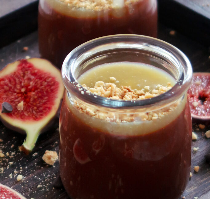 Macro shot showing the glossy finish and sea salt flakes on top of a Salted Caramel Chocolate Pot.