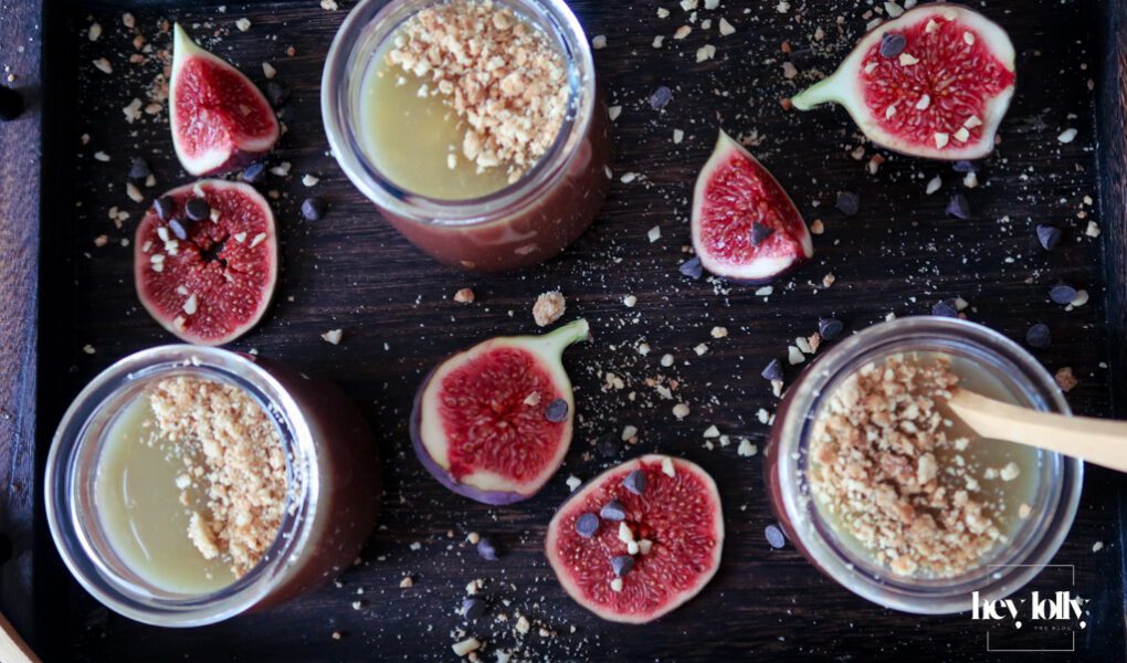 Salted Caramel Chocolate Pots served in small glasses, topped with glossy caramel and sea salt flakes.