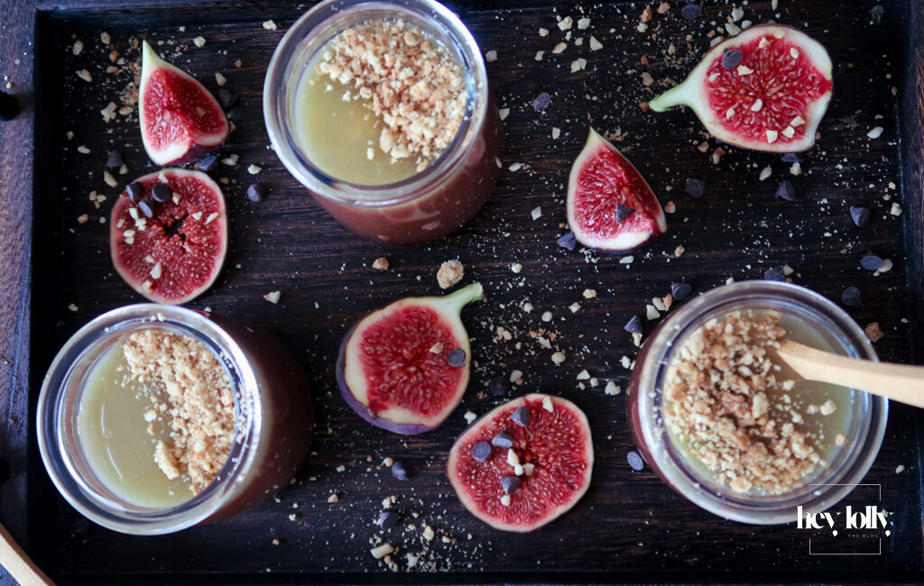 Salted Caramel Chocolate Pots served in small glasses, topped with glossy caramel and sea salt flakes.