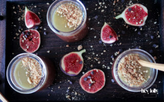 Salted Caramel Chocolate Pots served in small glasses, topped with glossy caramel and sea salt flakes.
