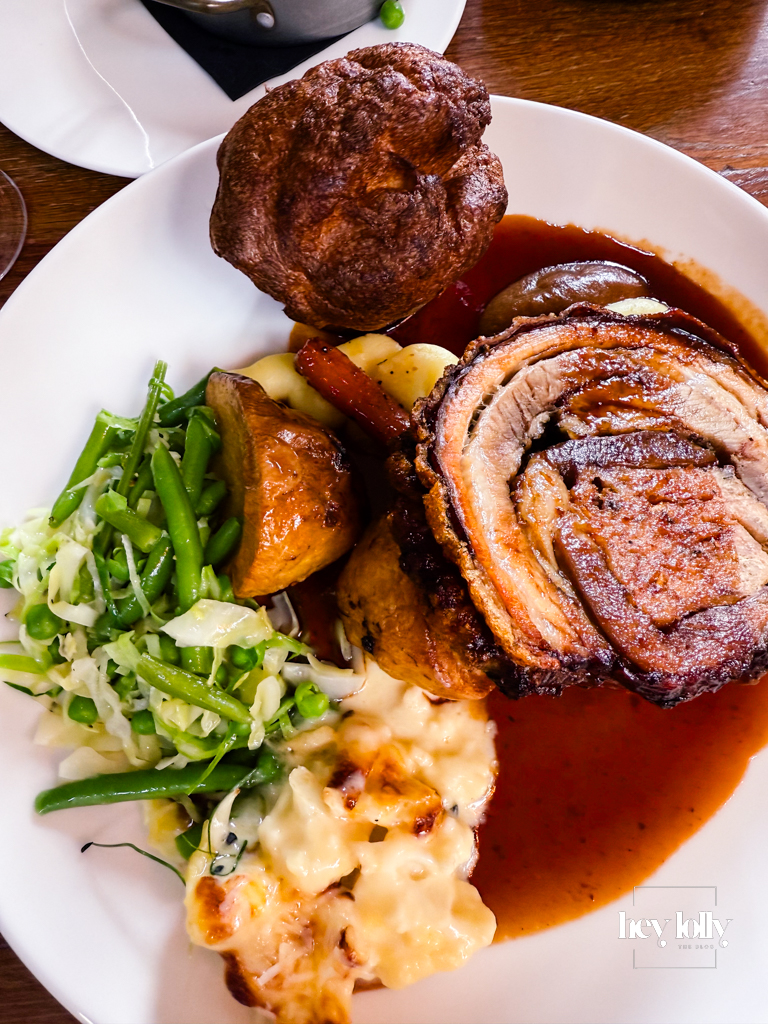 Roast pork belly with Yorkshire pudding, glazed carrots, and mash — Sunday lunch Nottingham plate.