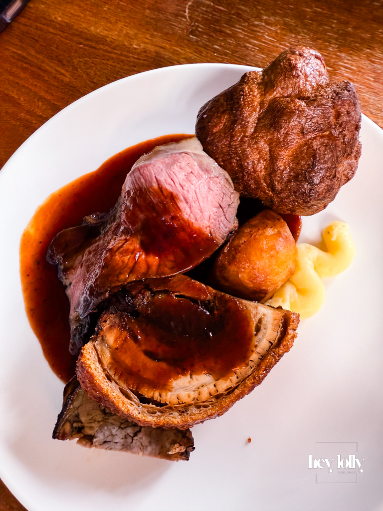 Trio of roast meats — beef, pork, and lamb — with roast potatoes, Yorkshire pudding, and seasonal vegetables, Sunday lunch Nottingham at The Griffin