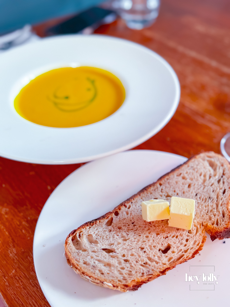 Spiced squash soup served with bread and hard butter — Sunday lunch Nottingham starter at The Griffin.