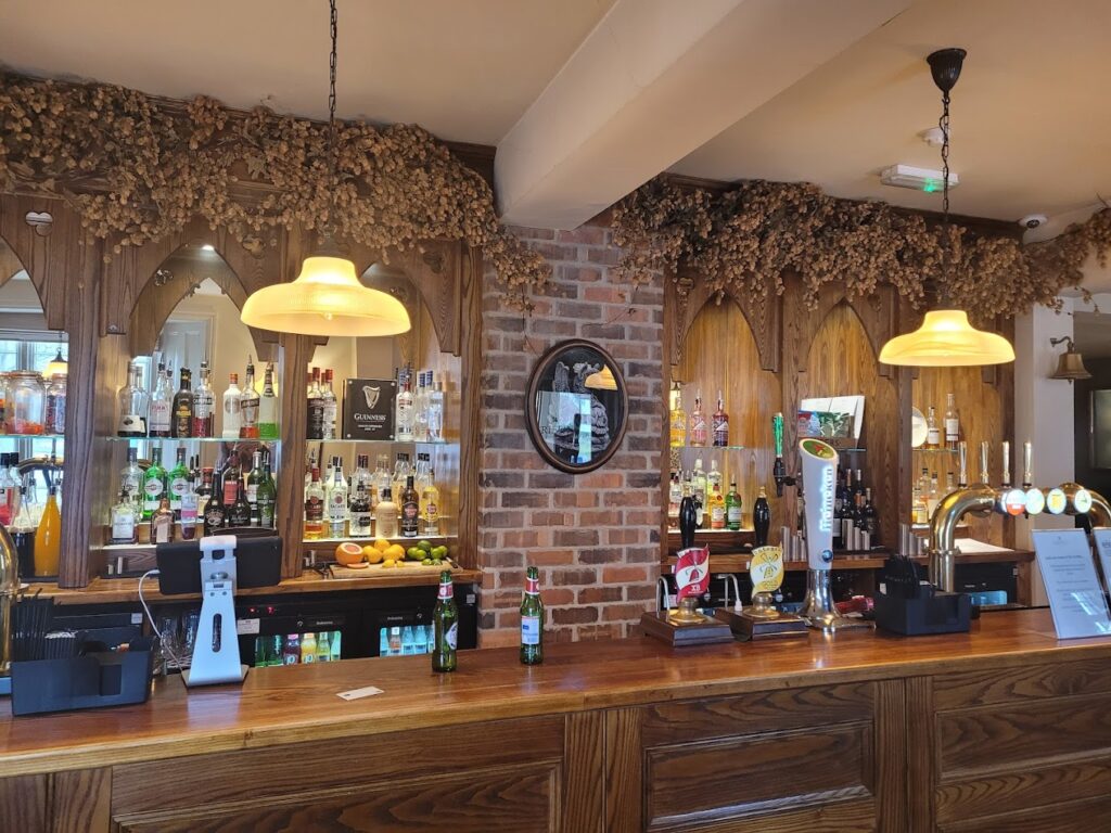 Bar area with plush seating and polished wood — Sunday lunch Nottingham pre-meal drinks setting.
