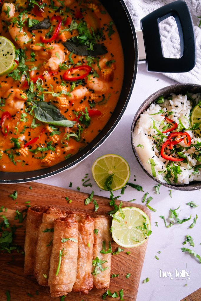 Finished Thai Red King Prawn curry served with jasmine rice and fresh coriander garnish.