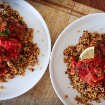 uicy Za’atar Chicken Thighs with golden skin and roasted tomato anchovy topping”