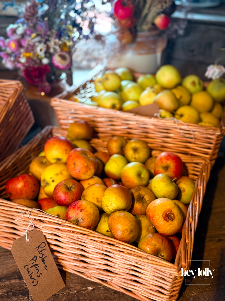 Wooden crates filled with small imperfect apples at Clumber Park’s walled kitchen garden in autumn.