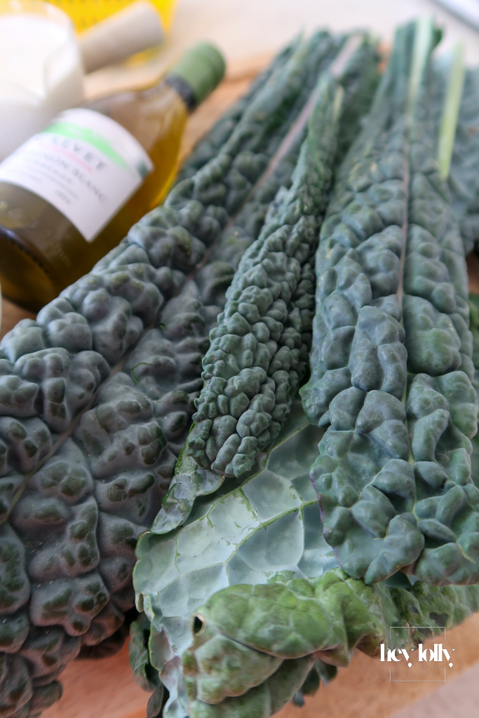 Fresh cavolo nero leaves torn and ready to be sautéed with lemon for garlic butter roast chicken side greens.