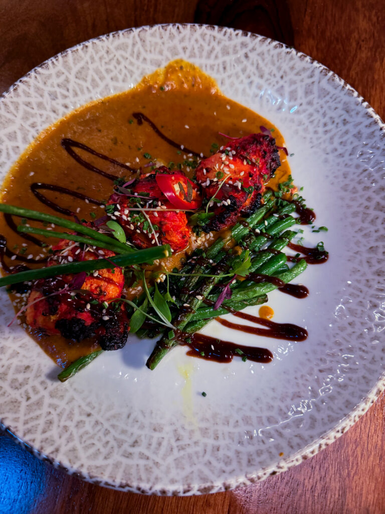 Tandoori Monkfish at Passan’s Nottingham — thick fillets with proper char, served with spiced sauce and fresh herbs.
