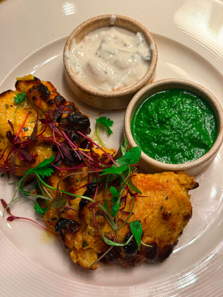 Saffron Chicken Tikka at Passan’s Nottingham — tender pieces of marinated chicken with light char and golden hue.