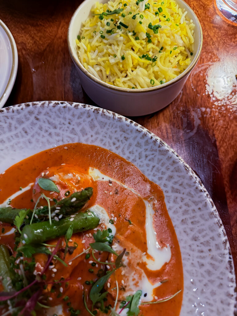 Malai Chicken at Passan’s Nottingham — creamy spiced sauce with roasted potatoes and asparagus with a side of fluffy pilau rice