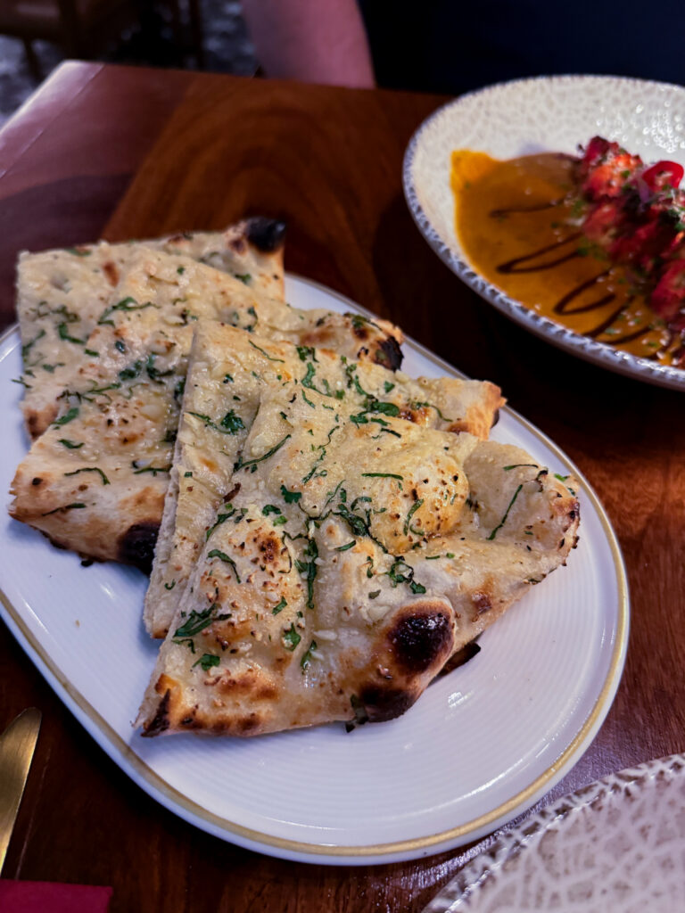Garlic Naan and fragrant Pilau Rice served alongside mains at Passan’s Nottingham.