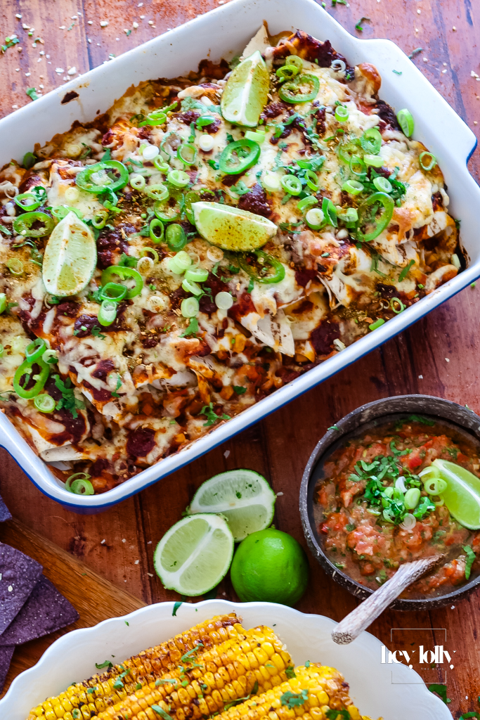 Close-up of baked enchiladas fresh from the oven, cheese bubbling and edges lightly browned.