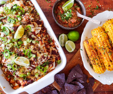 overhead shot of sweetcorn and butter bean enchiladas with salsa and tortilla chips