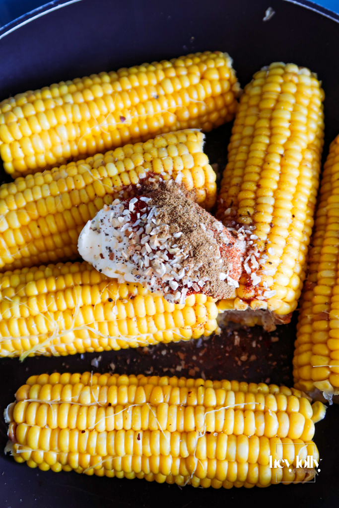 Sweetcorn kernels charring in a hot dry pan, turning golden with slightly blackened edges.