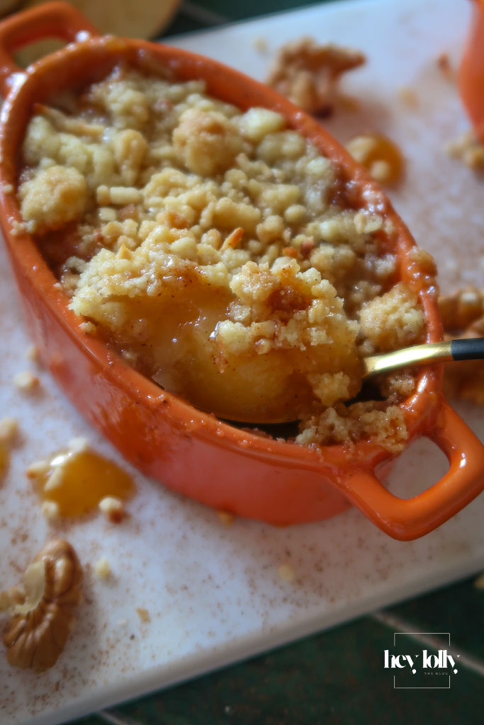 close up of spoon in apple and miso caramel crumble pot