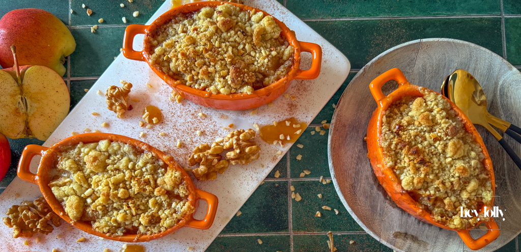 Apple and miso caramel crumble in white ramekins, bronzed sandy topping and glossy caramel drizzle.