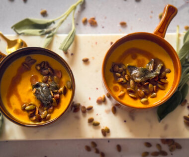 Bowls of Butternut Squash Soup with Sage Brown Butter, crisp sage and toasted pumpkin seeds